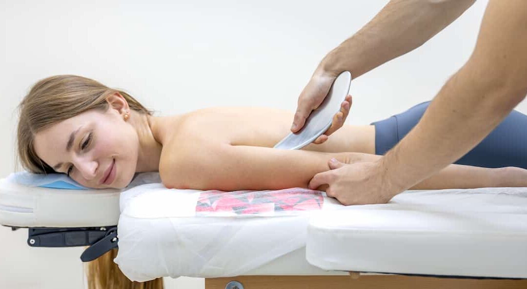 rehab-doctor-performs-iastm-gua-sha-female-patient-arm-tool-massage (1)