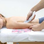 rehab-doctor-performs-iastm-gua-sha-female-patient-arm-tool-massage (1)